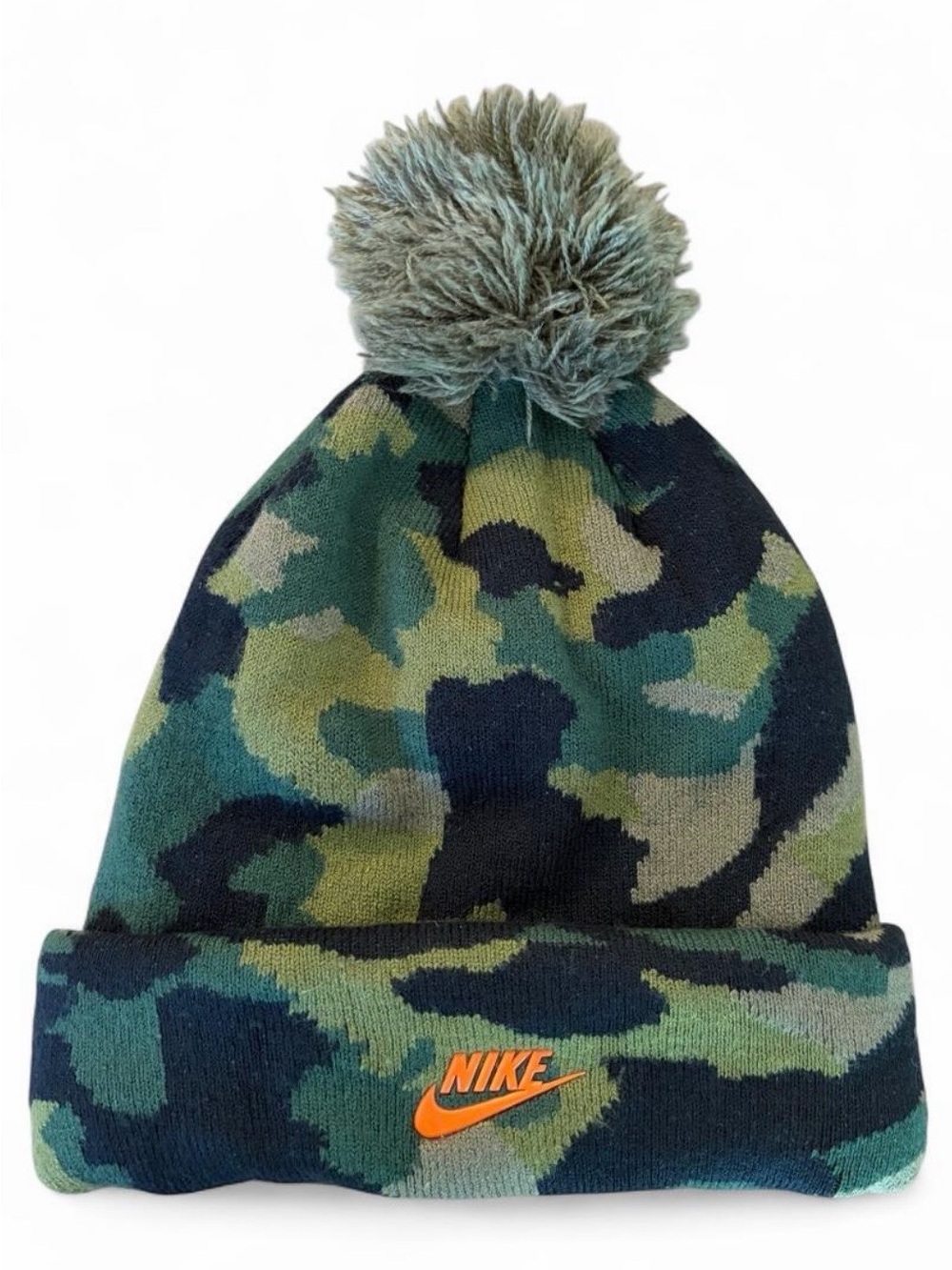 Nike Youth camo winter beanie with pom pom. Orange ‘Nike’ and swoosh on front